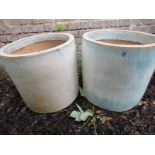 Two decorative garden plant pots with a green/blue paint effect on cream ground.
