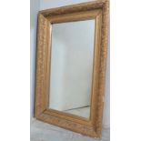 A 19th Century gilt framed rectangular wall mirror with floral design to border.