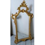 A late 19c gilt carved wall mirror with later glass panel.