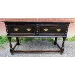 An 18th Century oak sideboard with two deep drawers and brass handles over lower stretchers.