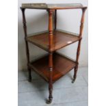 A pretty 19th Century rosewood three tier whatnot side table with brass gallery rails to each shelf
