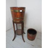 A jardiniere stand and two brass bound wooden bowls of planter size, with removable marked liners,