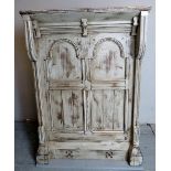 A decorative grey painted Gothic-Revival lectern with panelled design.