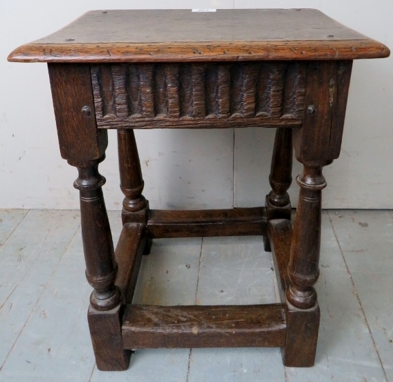 A 17th Century and later country oak joint stool with a carved linen fold frieze over turned - Image 3 of 8
