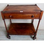 A 19th Century rosewood side table with a single drawer over fine turned upright supports and a