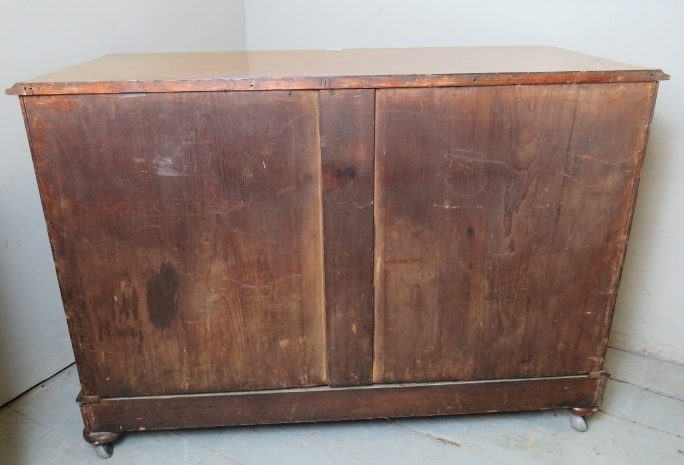 A Victorian mahogany low chest of two short over two long flame mahogany drawers with bun handles - Image 3 of 3