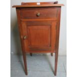 Edwardian mahogany bedside pot cupboard with a single drawer over a cupboard door.