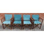 A set of four vintage folding director's chairs with green material to back and seats and complete