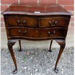 A 19th Century mahogany side table with two small and one long drawer over shell carved cabriole
