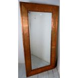 A large rectangular contemporary copper effect wall mirror Condition report: Overall condition is