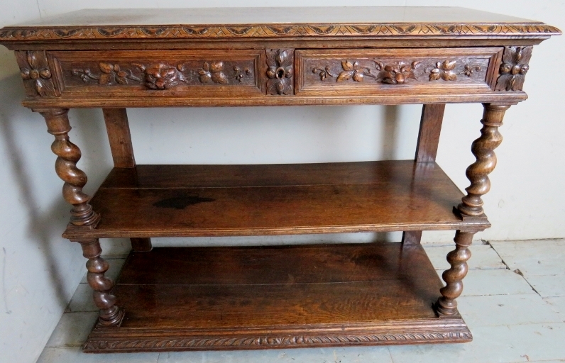 A Victorian carved oak buffet table with a lift up top revealing a white marble inset top and