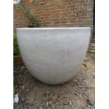 A very large and decorative garden pot, suitable for a tree or large plant.