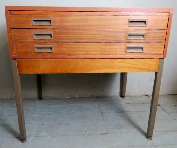 A contemporary teak architect's table with three long plan drawers.