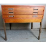 A contemporary teak architect's table with three long plan drawers.