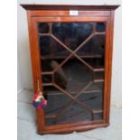 A pretty Edwardian mahogany inlaid corner wall cupboard, with astral glazed door,