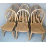 A set of six late 19th / early 20th Century stripped elm Windsor kitchen chairs.