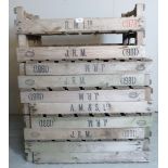 A collection of ten vintage agricultural produce stacking crates.