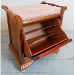 A 19th Century mahogany piano seat with a fall front sheet music cupboard and an upholstered seat