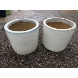 Two cream garden planters / pots with green/blue paint effect design.