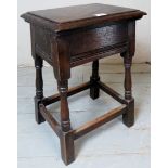 A 19th Century oak joint stool with turned legs over lower stretchers.