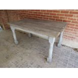 A 19th Century solid oak planked top dining table with a grey painted base.