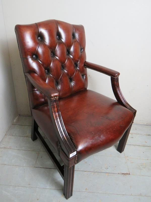 An excellent quality 20th Century open sided leather office desk chair upholstered in a burgundy