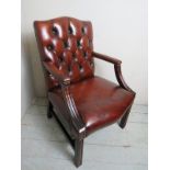 An excellent quality 20th Century open sided leather office desk chair upholstered in a burgundy