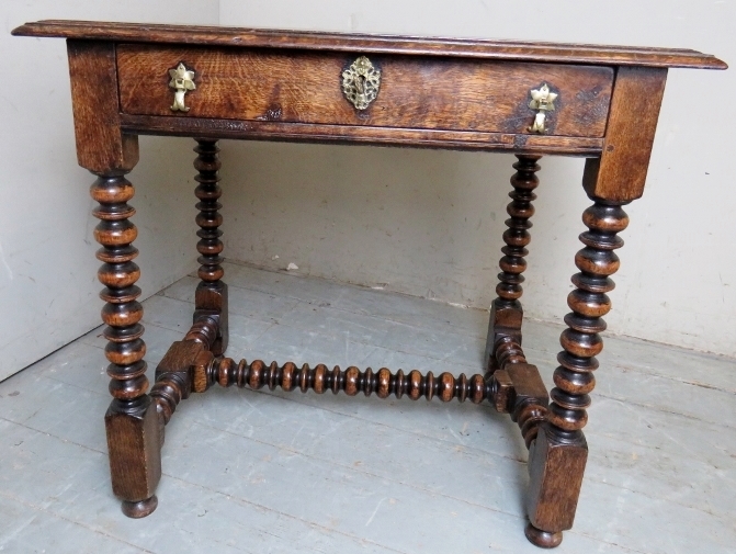 A good quality Bylaws replica 17th Century style side table with a single frieze drawer having