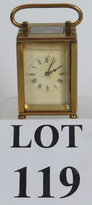 A miniature French brass carriage clock