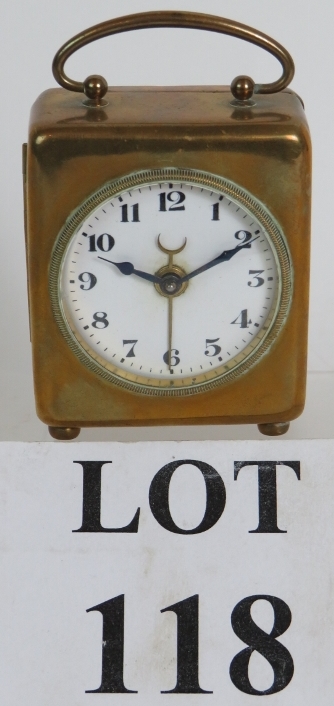 A small brass cased antique alarm clock