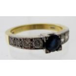 A hand made 18ct yellow and white gold ring, set with centre faceted sapphire, approx weight 0.