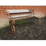 A vintage wrought iron and slatted wood