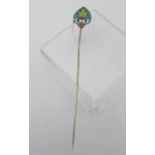 An Arts & Crafts silver gilt Plique a Jour enamelled hat pin.