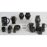A collection of 15 pieces of black lustre Sussex studio pottery including Dicker ware,