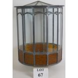 A large leaded glass terrarium with removable lid.