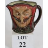 A rare Royal Doulton double sided Mephistopheles character jug, 14.5cm high.