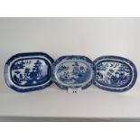 Three antique blue and white meat platters, one very early example. Largest: 39cm wide.