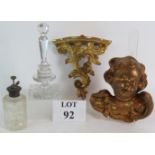 A gilt plaster Rococo Putti, a gilt shelf bracket,