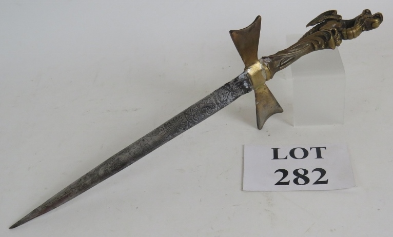 A bronze dragon handled Medieval style dagger with a highly ornate antique blade.