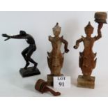 A pair of carved hardwood Siamese dancing figures and a carved Ebony Nubian dancer signed Souza.