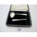 A silver child's spoon and pusher, Sheffield 1929, approx weight 45 grams/1.4 troy oz, boxed.
