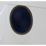 A 14ct gold large oval lapis lazuli ring, size M. Condition Report: Some wear on the gold surround.