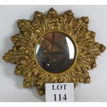 A 1960's gilt Rococo surround convex mirror with original Art Ware label to reverse.