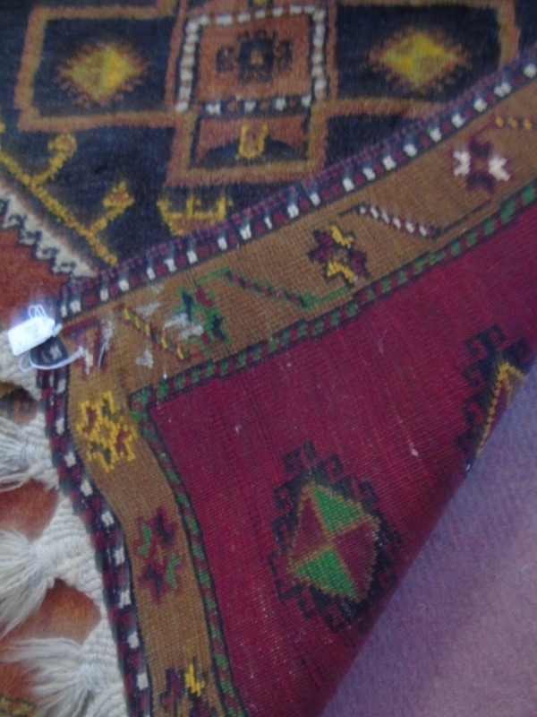 An early-mid 20's Turkish runner with repeated central motif on a red ground and tan border. - Image 4 of 4