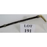 A rare 19th Century baleen riding crop with antler handle and woven white metal mounts bearing the