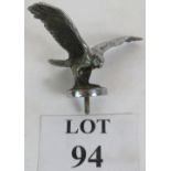 A vintage chrome car mascot in the form of a standing eagle with spread wings. Width 16cm.