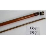 An antique Malacca cane incorporating a excise beer and wine measuring stick. Overall length: 91cm.