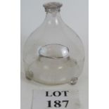 A Georgian glass wasp trap with three squared feet, string neck and original stopper. Height: 17cm.