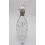 A good cut glass decanter and stopper with silver collar, hallmarks worn.