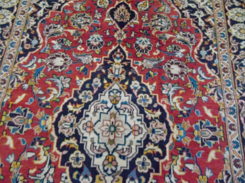 A Persian rug with central pattern on red ground, 146cm x 108cm. - Image 3 of 4